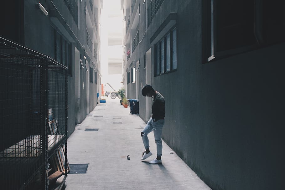 man standing between buildings, apparel, clothing, shoe, footwear HD wallpaper