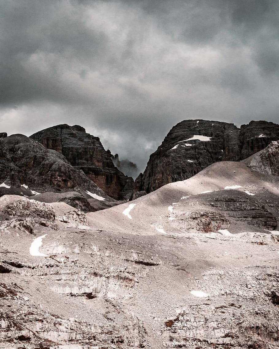 gray mountain across dark clouds, ground, nature, outdoors, gravel HD wallpaper