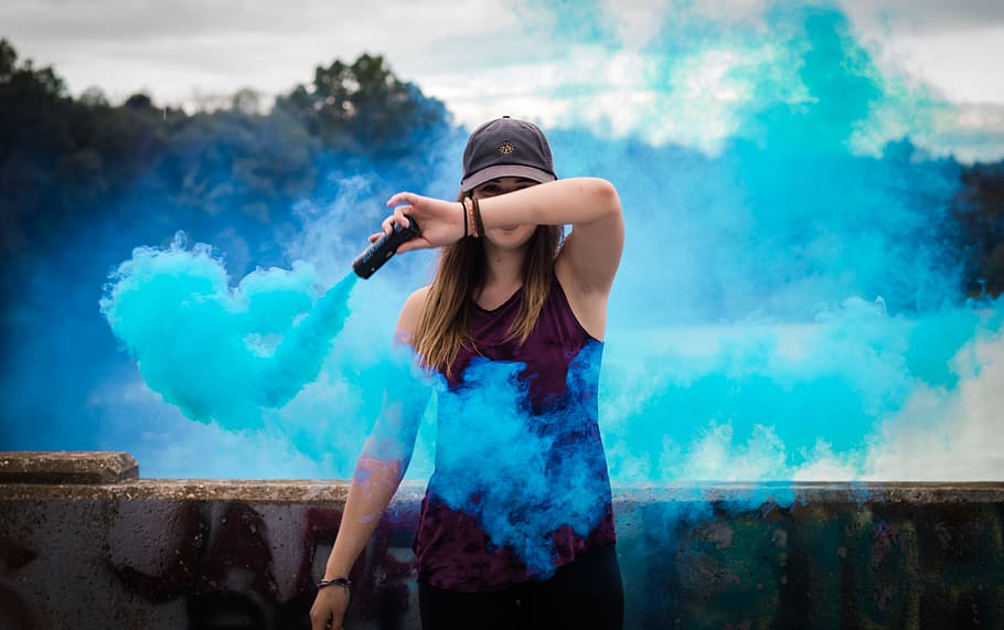 Woman Holding Blue Smoke Flare, adult, beautiful, blur, colored smoke