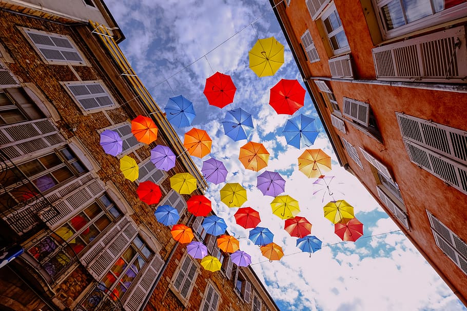 Assorted-color Umbrellas Hanged Near Brown Building, architectural design HD wallpaper