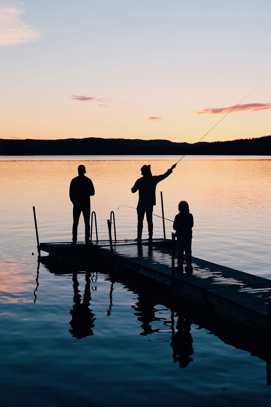 Three People on a Wooden Fishing Docks, backlit, beach, dawn HD wallpaper
