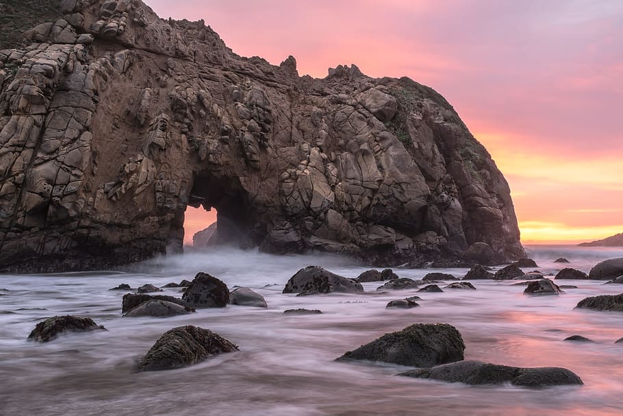 rocky ocean near tunnel, sea, sunset, cliff, wafe, arch, seashore HD wallpaper