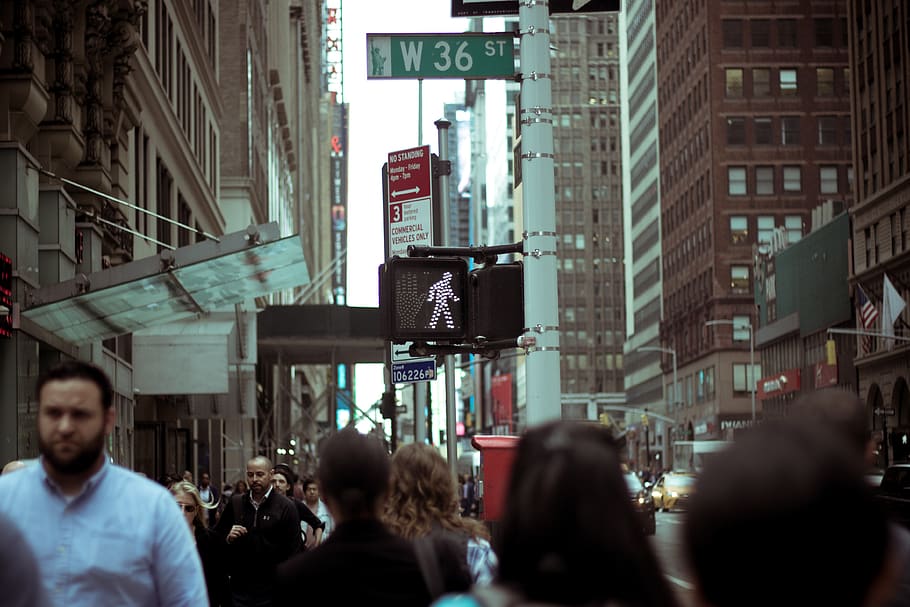 people-at-w36-street-near-brown-buildings-during-daytime.jpg