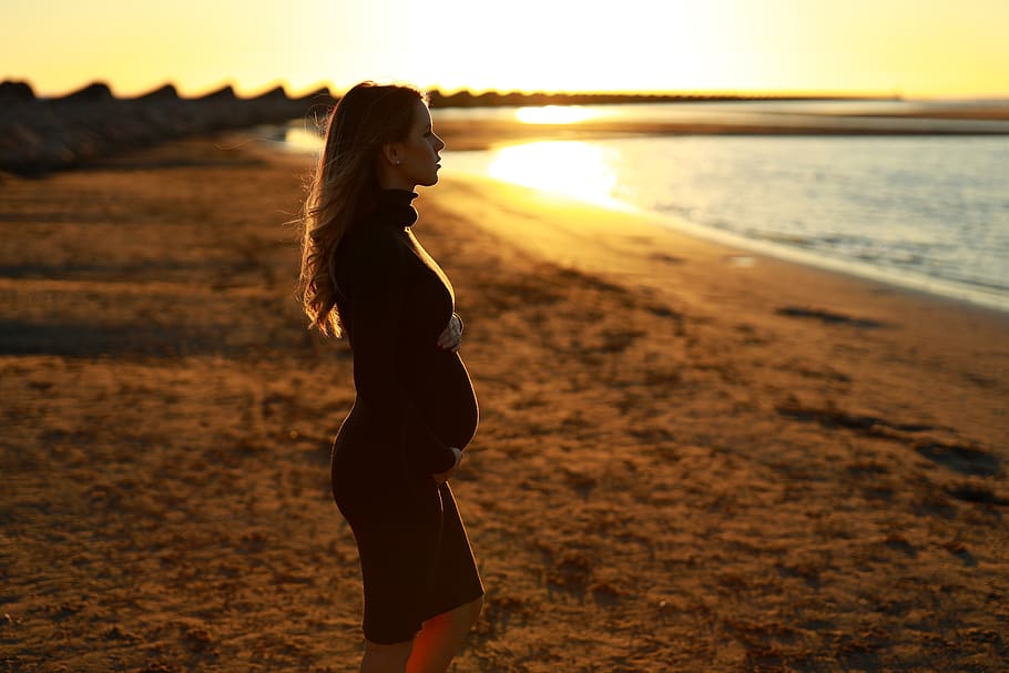 woman standing while facing shore, one person, land, sunset, young adult HD wallpaper