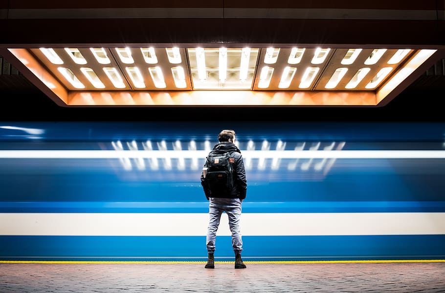man in black backpack, illuminated, real people, one person, indoors HD wallpaper