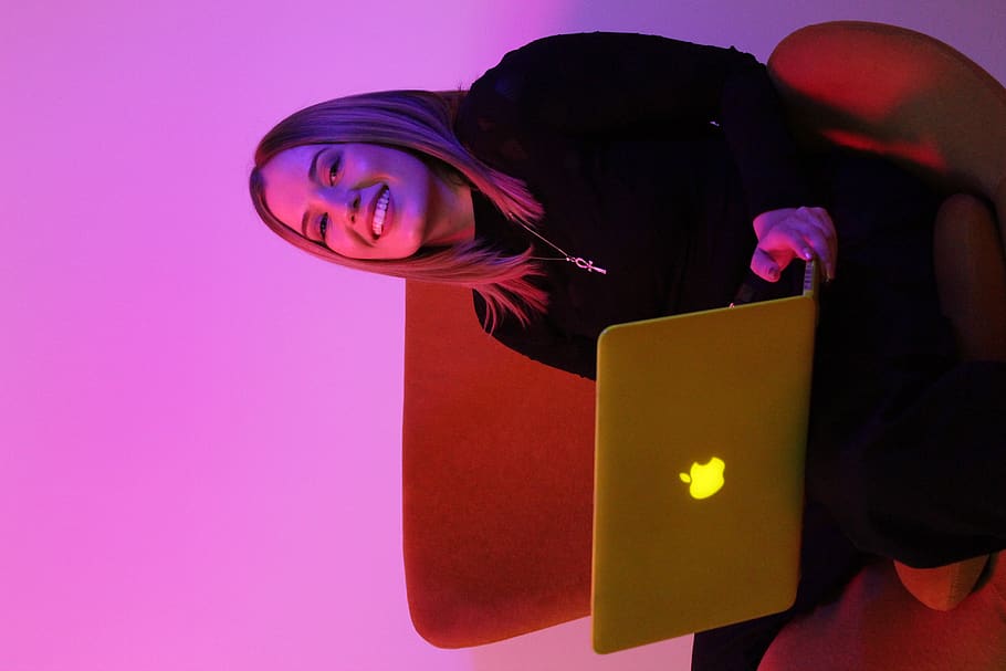 sitting woman while using MacBook, pc, electronics, computer HD wallpaper