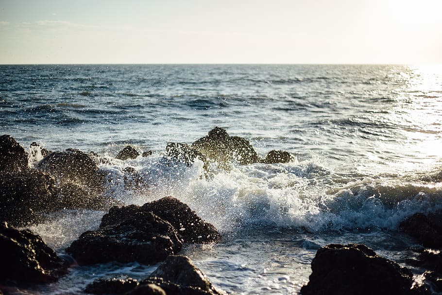 Photo of Blue Ocean Wave Coming to the Rocky Shore, breakers HD wallpaper