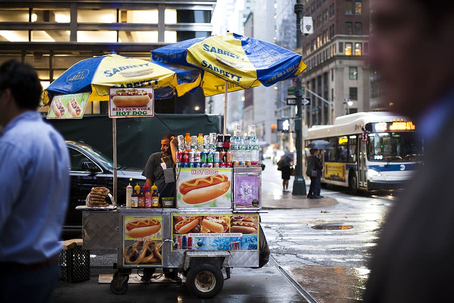 hotdog vendor in intersection, person, human, people, vehicle