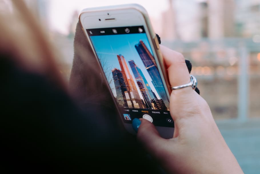 person using iPhone, smart phone, human hand, wireless technology HD wallpaper
