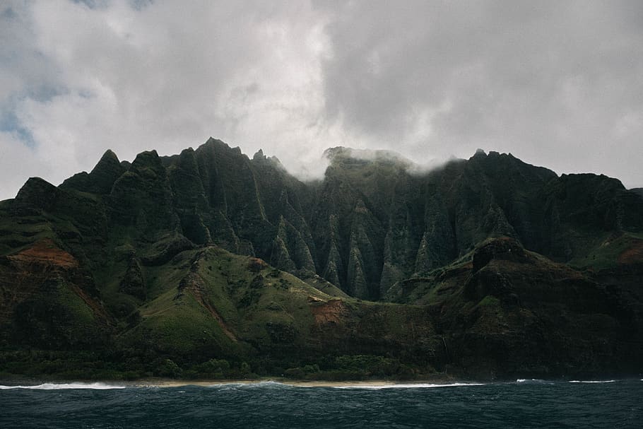 grey clouds hovering above mountain island, water, sky, scenics - nature HD wallpaper