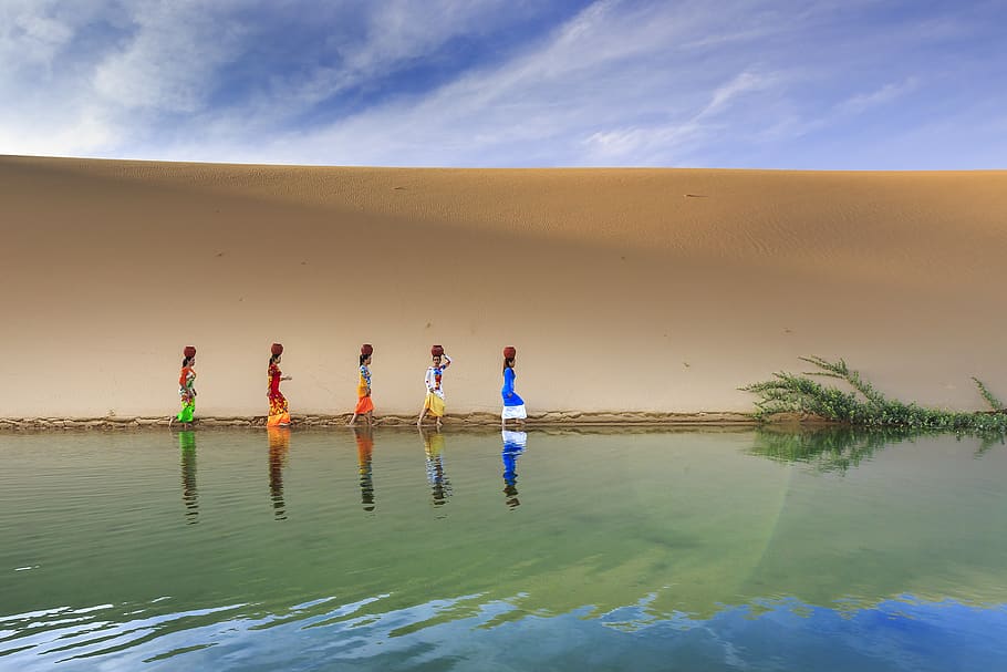 Multicolored Painting of Women Standing Beside Body of Water HD wallpaper