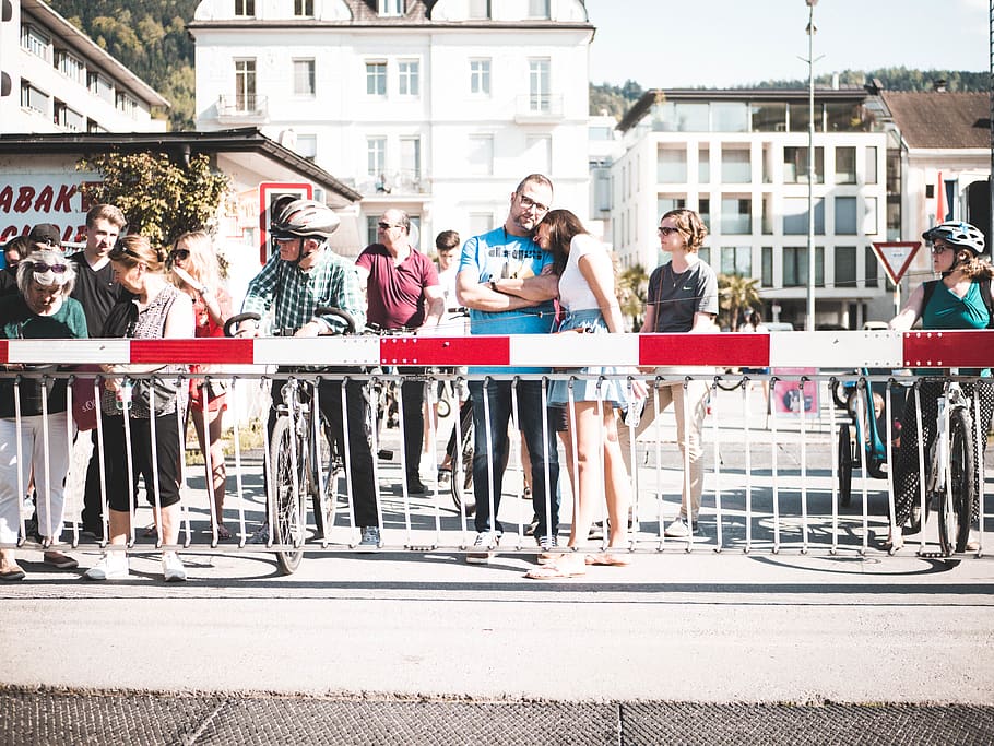 People Standing Near Handrail, buildings, crowd, gate, man, rails HD wallpaper