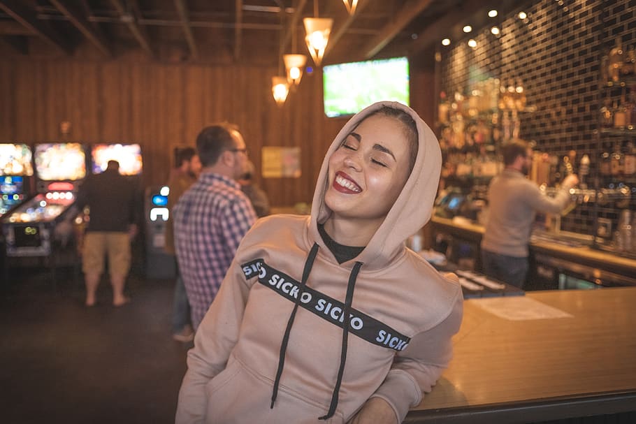 Photo of Smiling Woman Wearing Pullover Hoodie, attractive, bar HD wallpaper