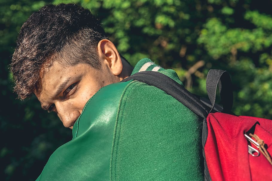 kid, school, real people, one person, focus on foreground, green color