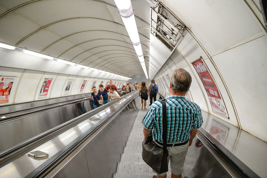 Man Wearing Blue Plaid Shirt Standing on Subway Escalator, commuter HD wallpaper
