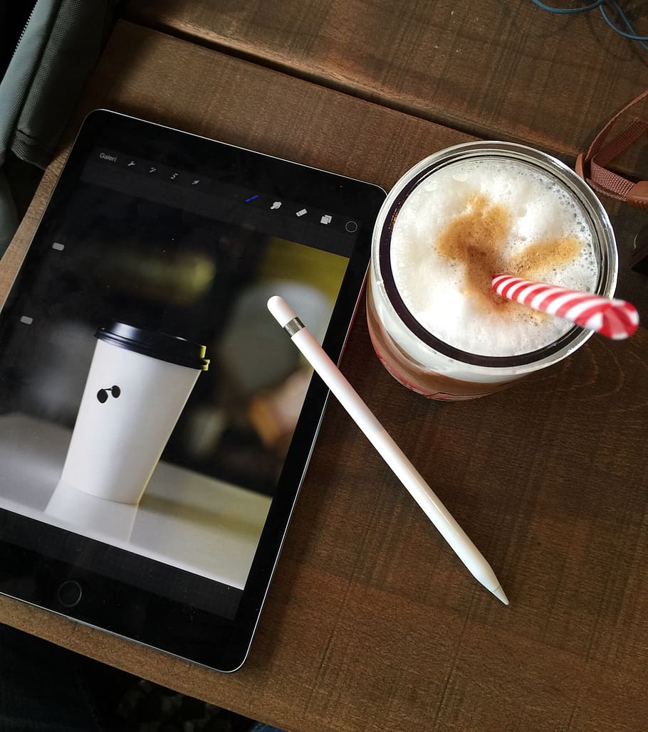 White Apple Pencil on Turned-on Black Ipad Pro Displaying Disposable Cup HD wallpaper