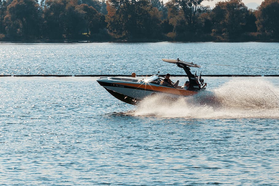 Person Driving Black and Orange Speedboat, action, daylight, landscape HD wallpaper