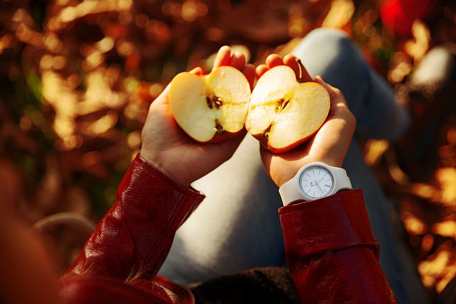 Person Holding Sliced Apple, food, fruit, hands, time, wristwatch HD wallpaper
