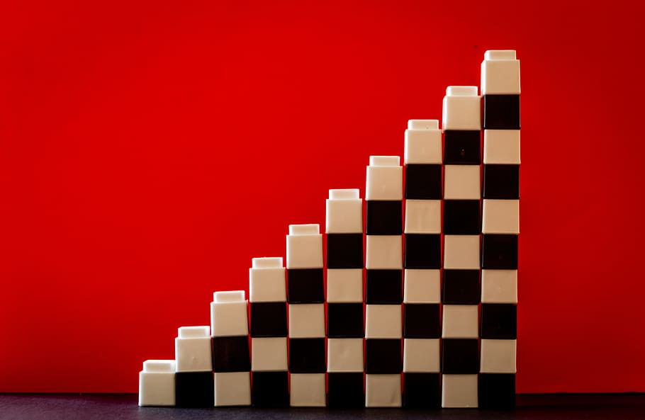 White and Black Checkered Brick Toys Stacked on Top of Each Other Forming Ladder HD wallpaper