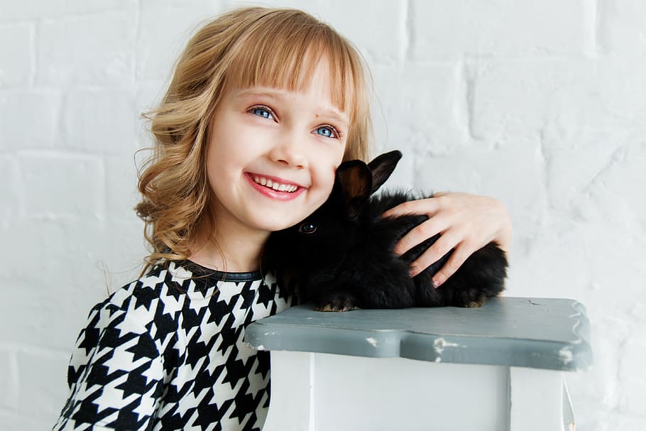 Girl Holding Black Rabbit, adorable, animal, attractive, blond hair