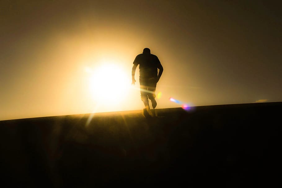 Rear View of Silhouette Man Against Sky during Sunset, backlit HD wallpaper
