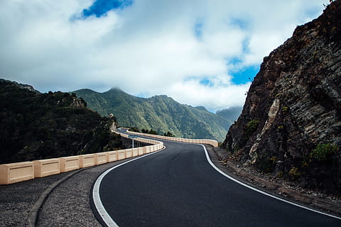 Black Asphalt Road Near Cliff Mountain, clouds, curve, daylight HD wallpaper