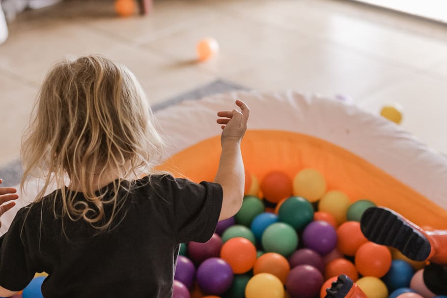 toddler playing with balls, rear view, one person, blond hair HD wallpaper
