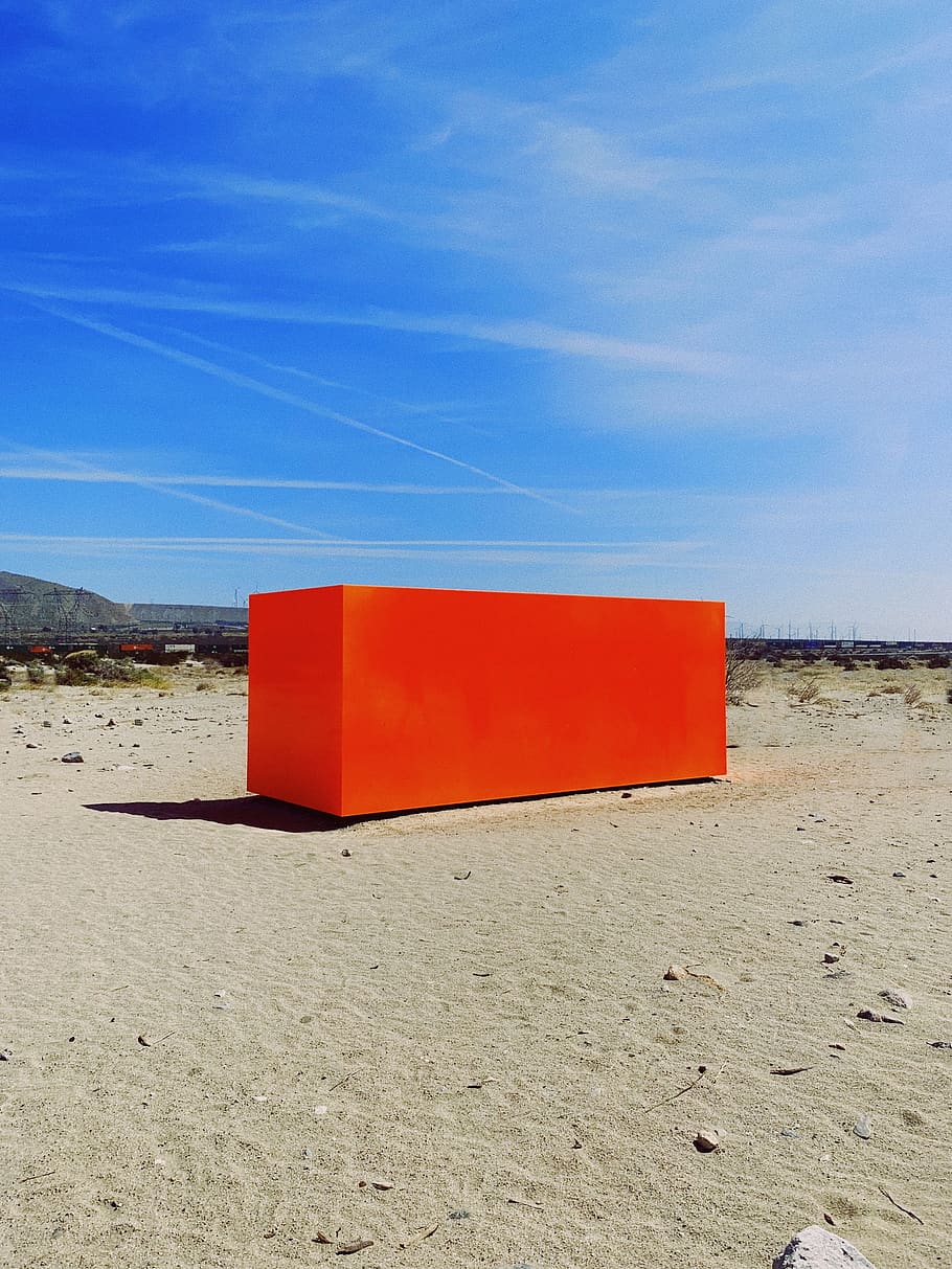 rectangular red container on sand outdoors during daytime, ground HD wallpaper