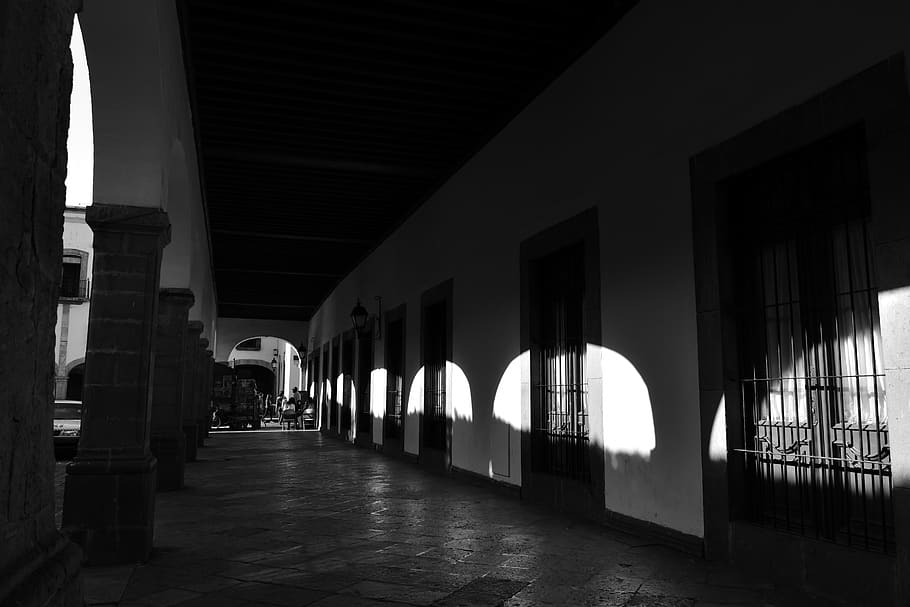 dim hallway with pillars, corridor, person, human, flooring, flagstone HD wallpaper