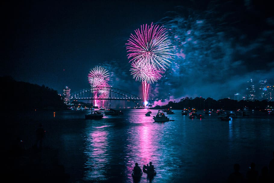 fireworks above long bridge at night-time, nature, outdoors, person