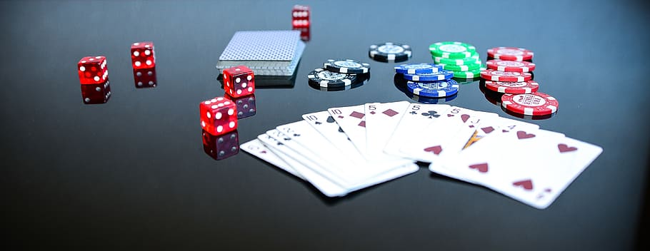 Playing Cards Beside Poker Chips and Dice, ace, blur, card game