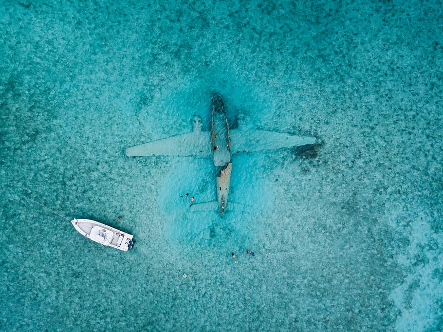 Top View Photo of Boat Near Airplane, aircraft, drone photography