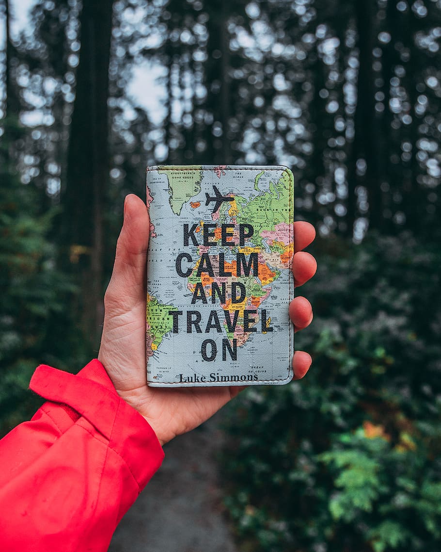 Keep Calm and Travel on bag, person, human, finger, text, forest