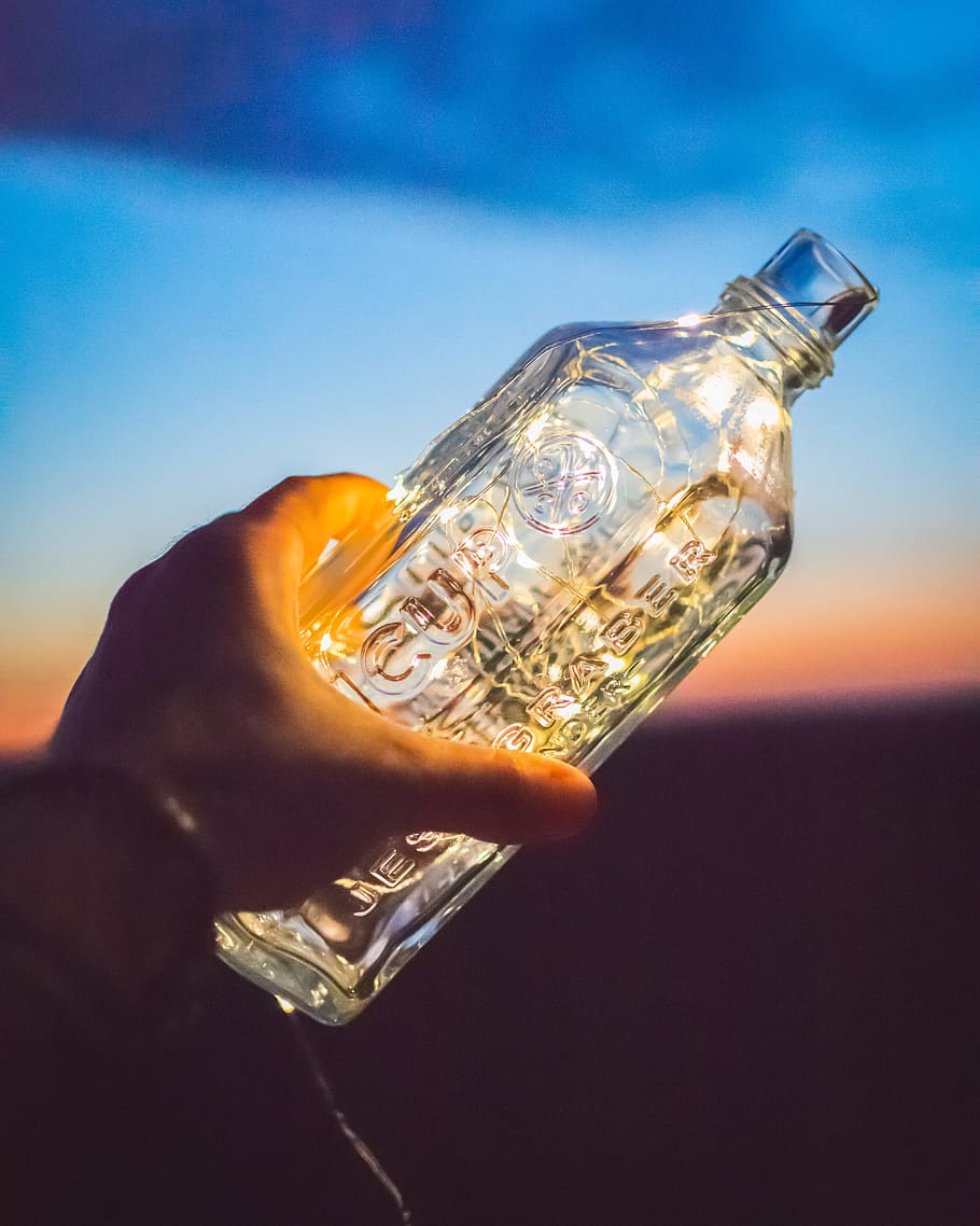 Clear Glass Bottle, bright, crystal, empty, hand, holding, luxury HD wallpaper