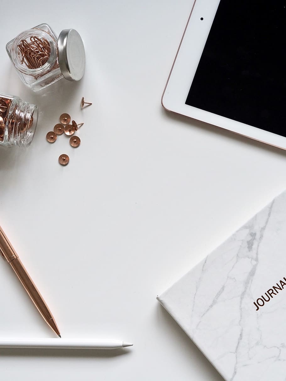 White Ipad On The Table Near Small Clear Glass Jars, desk, diary HD wallpaper
