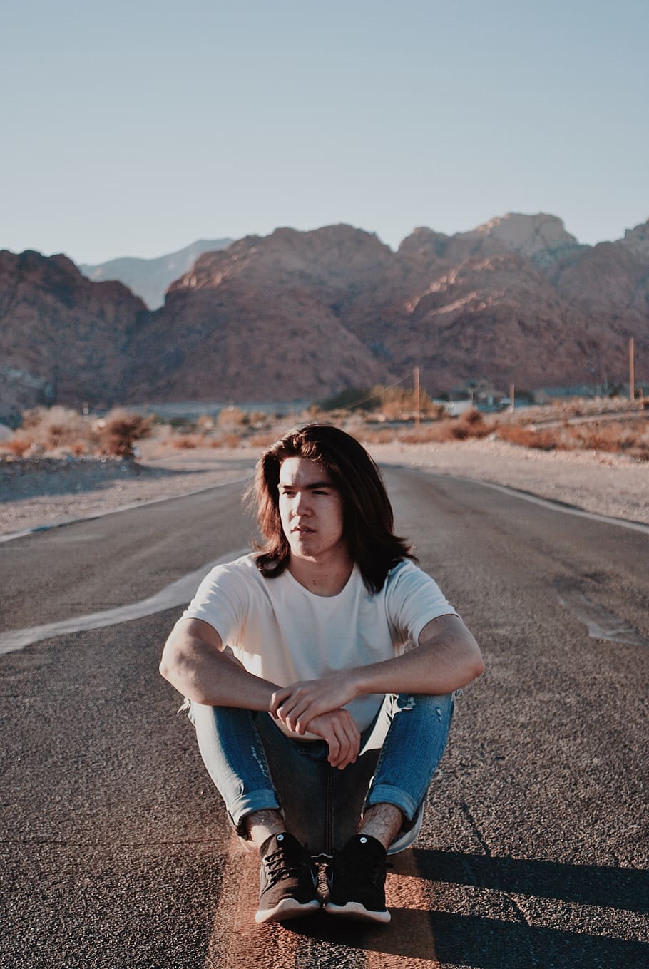 man sitting on highway, apparel, clothing, person, human, asphalt HD wallpaper