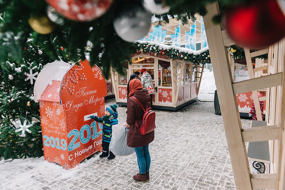 Toddler and Woman Standing at Booth, celebration, christmas decorations HD wallpaper