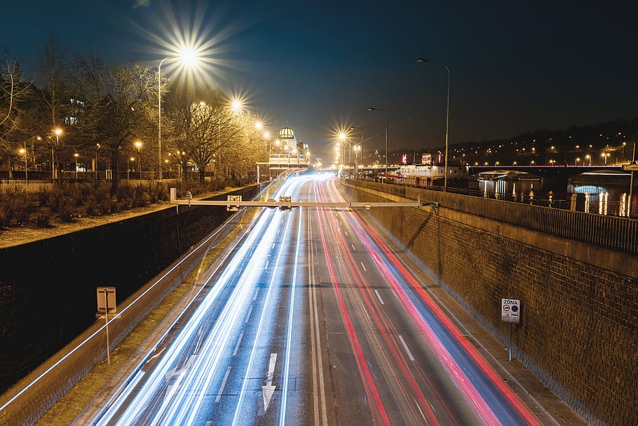 Car lights on the night highway in the city, illuminated, long exposure HD wallpaper