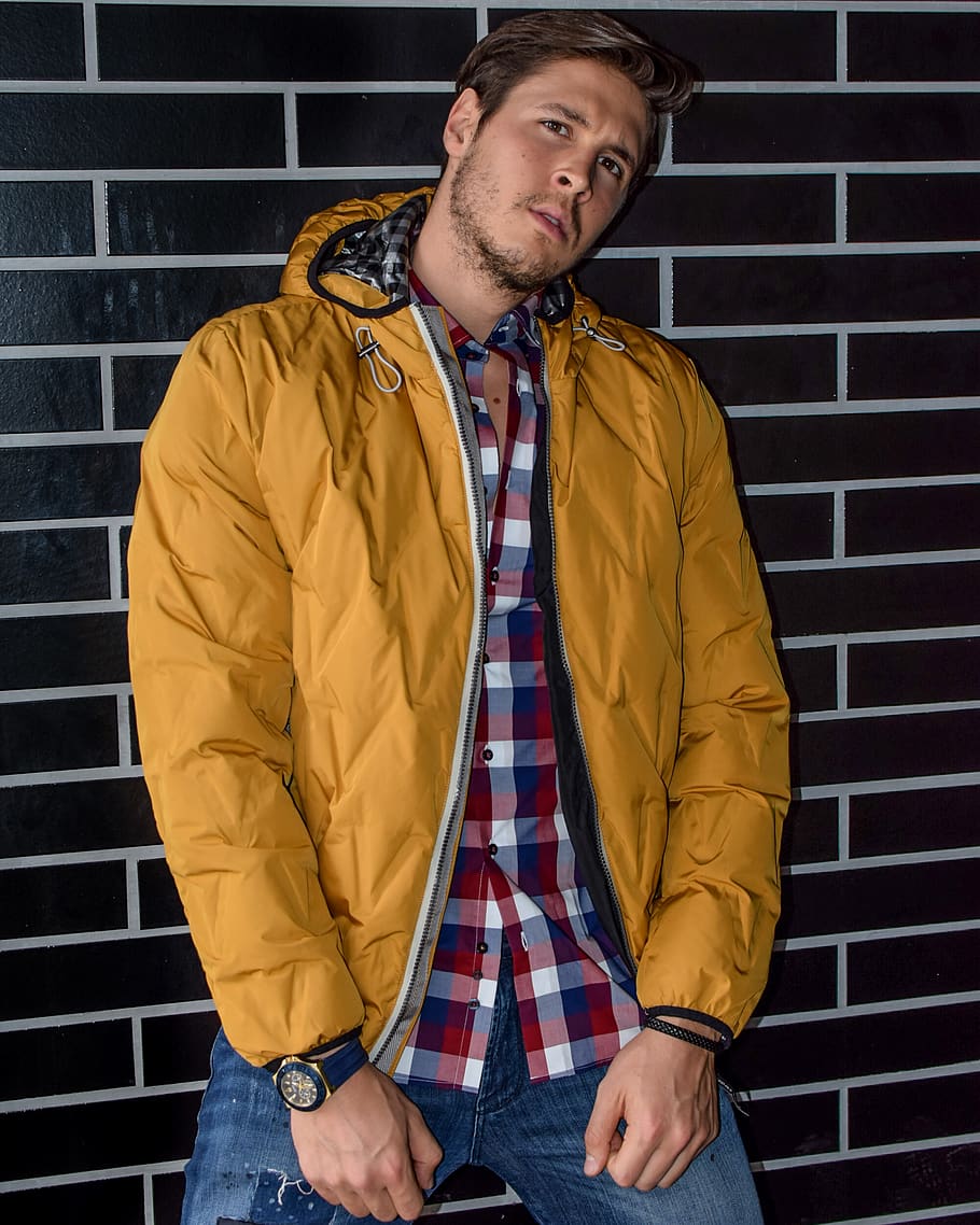 Man Wearing Yellow Zip-up Jacket Leaning on Brown Brick Wall, HD wallpaper