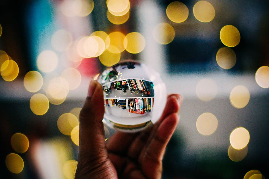 person holding clear crystal ball with bokeh background photography, HD wallpaper