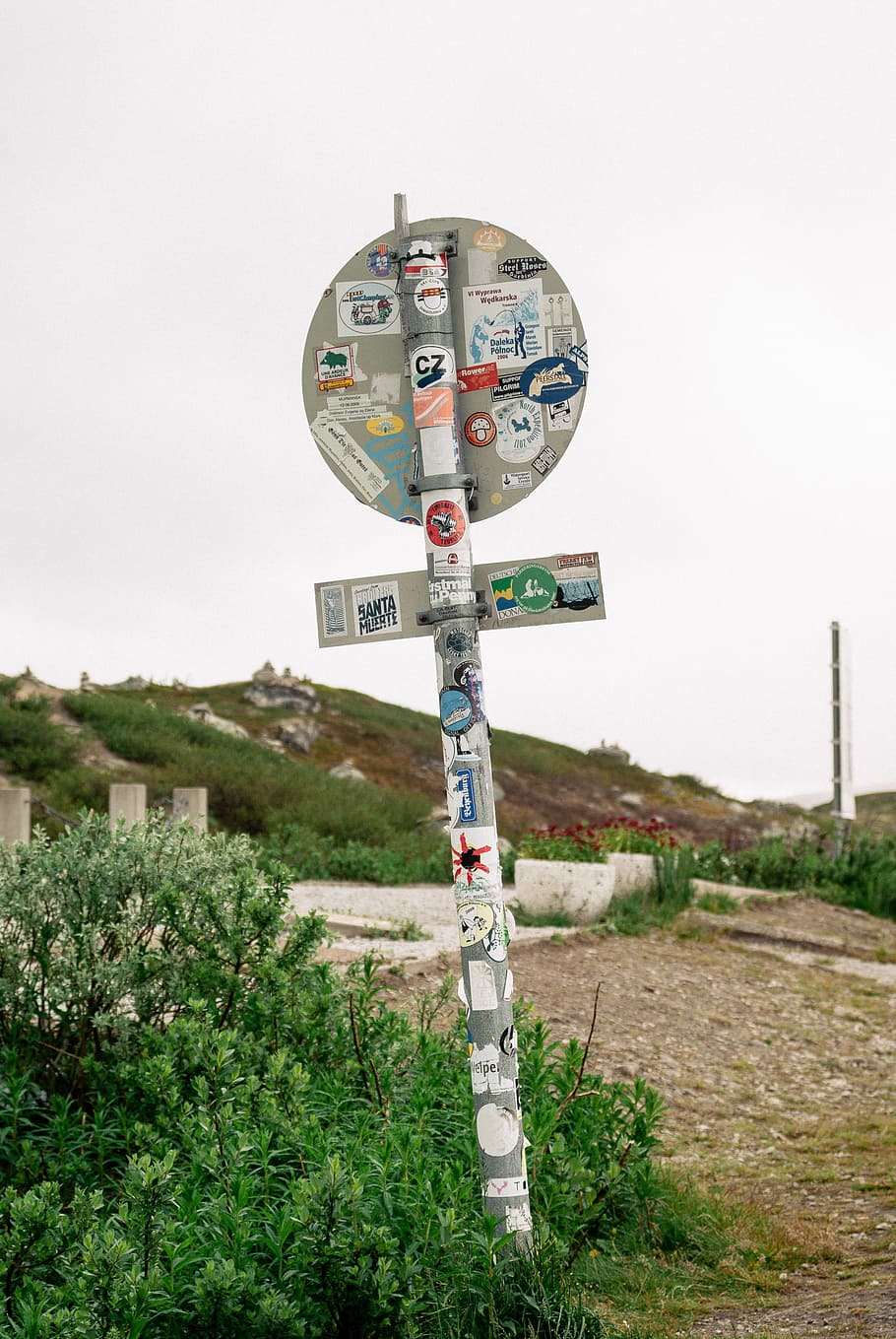 Road sign with stickers, covered, exploration, explore, five HD wallpaper