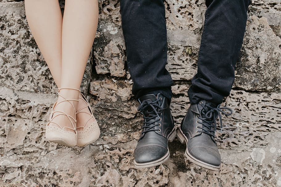 man wearing black shoes beside woman wearing flats, apparel, footwear