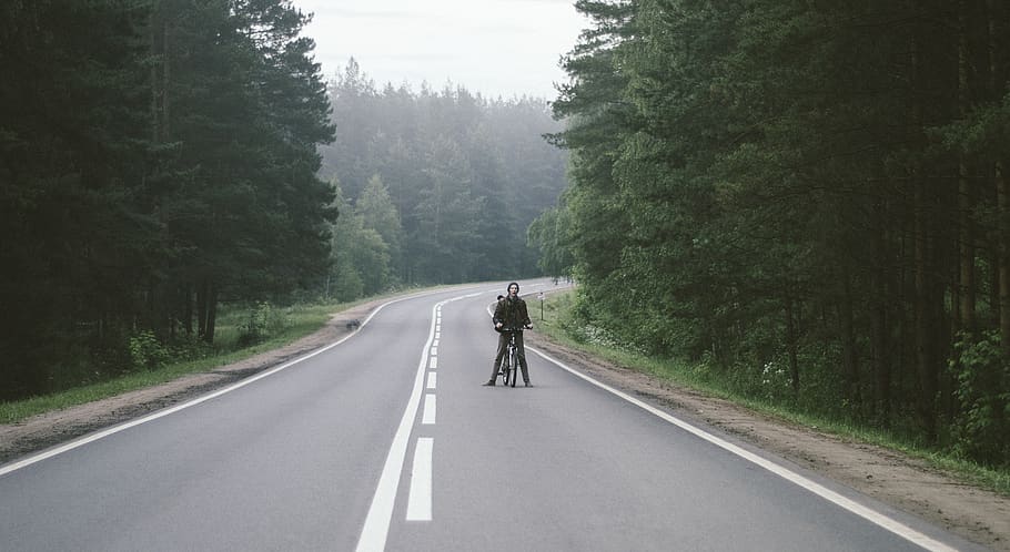Man With Black Bicycle, asphalt, curve, forest, green, guidance HD wallpaper