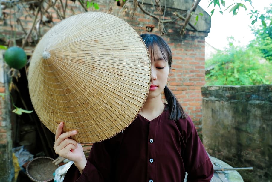 woman closing her eyes while holding straw hat, real people, one person, HD wallpaper