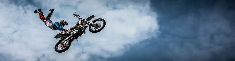 Man With Off Road Motorcycle Doing Tricks, biker, clouds, extreme HD wallpaper
