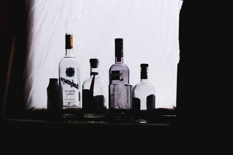 four clear glass bottles in dim light, azerbaijan, guba, quba HD wallpaper