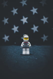 Lego astronaut on gray surface, toy, pet, animal, mammal, cat HD wallpaper