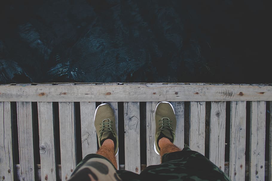 Man Standing on Brown Wooden Dock, daylight, flowing, hairy, legs HD wallpaper