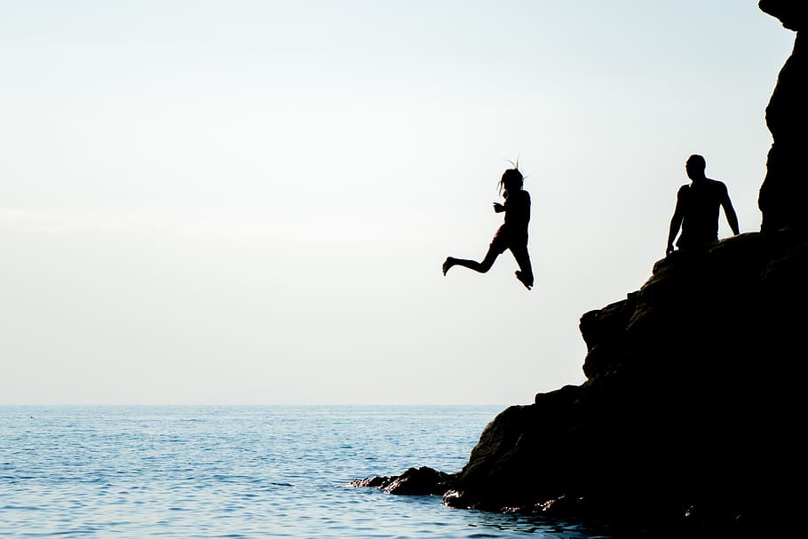 sea, waterjump, silhouette, jumping, rock, sky, rock - object HD wallpaper