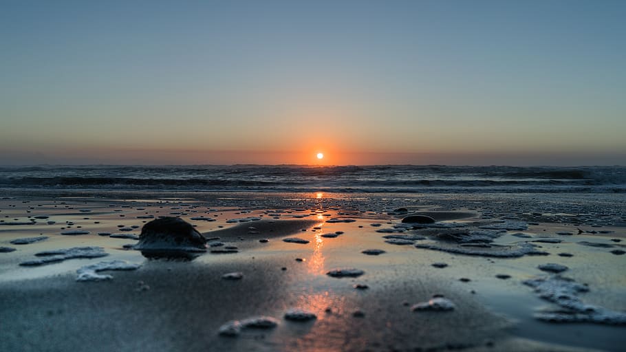 Sunset view across the ocean, sky, water, beach, sea, scenics - nature HD wallpaper
